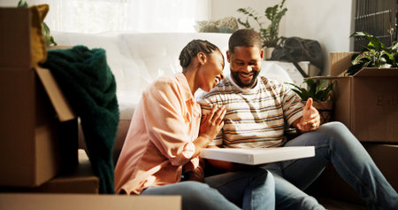 Pizza, moving and new house of black couple as happy home owners, relocation and eating on break....