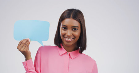 Portrait, happy woman and speech bubble in studio for opinion, idea or news. Smile, person and...