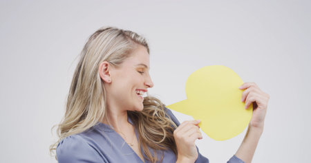 Smile, woman and talking with speech bubble in studio for announcement, news and signage. Mockup...