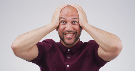 Portrait, shocked and mind blow with man in studio for announcement, good news and hearing secret....