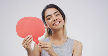 Portrait, happy woman and speech bubble in studio for social media, faq or forum. Smile, person or...
