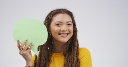 Braces, portrait and speech bubble with woman in studio for communication, opinion or voice....