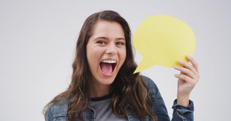 Portrait, speech bubble and woman in studio, feedback and communication on white background....