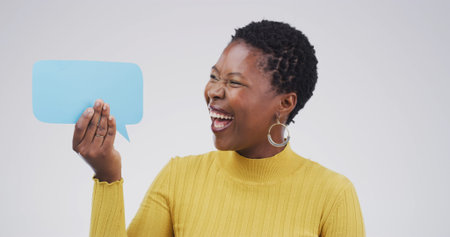 Black woman, laugh and excited with speech bubble, studio and mock up space by white background....