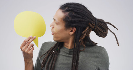 Communication, speech bubble and man in studio, feedback and announcement on white background....