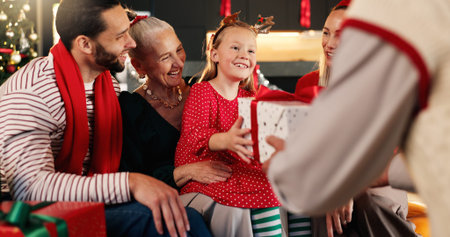 Christmas, home and family with present, girl and excited with smile, holiday season and giving....