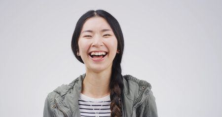 Laughing, student and Asian woman with pride, portrait or smile for opportunity to learn and studio....