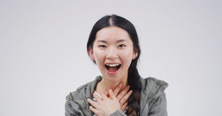 Shock, winner and portrait with asian woman in studio for excited, scholarship or deans list...