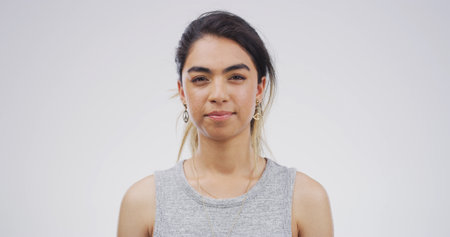 Portrait, student or woman with pride in studio of education, scholarship and college. Female academic, knowledge or learning course, studying opportunity or university curriculum on white backgroundの写真素材