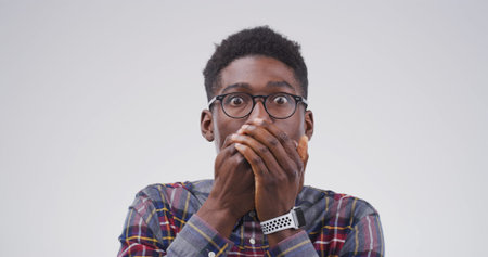 Portrait, black man and shocked expression in studio for gossip reaction, bad news and fake rumor....