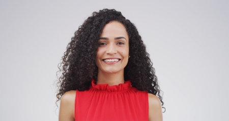 Knowledge, portrait and smile of tutor on studio space for development, learning or university study. College, future and growth with happy woman isolated on white background for education or schoolの写真素材