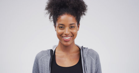 Education, portrait and smile of student on studio space for development, learning or university study. College, future and growth with woman isolated on white background for knowledge or schoolの写真素材