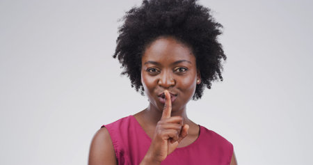Hush, portrait and privacy with black woman on studio space for gossip, secret or silence. Emoji,...