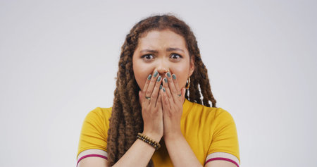 Scared, portrait or girl with shock in studio for traumatic event, bad news or overwhelmed by fear....