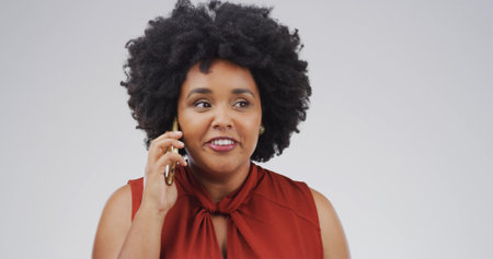 Face, phone call and thinking with woman on studio space for negotiation or networking. Communication, conversation and ideas with African person isolated on white background for mobile feedbackの写真素材