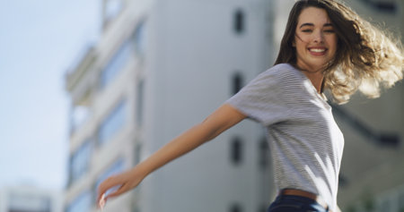 Student, fashion and portrait of woman in city for college education, opportunity and gen z style. University, scholarship and streetwear with low angle of person at campus space, trendy and futureの写真素材