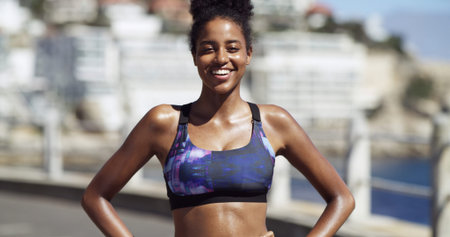 Portrait, athlete and woman on break, outdoor and smile for training routine on street and wellness....