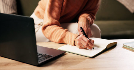 Hands, person and writing on journal in home for reminder, agenda or planning with ideas. Diary,...