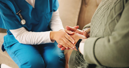 Holding hands, empathy and nurse with senior woman in retirement home with comfort for diagnosis....