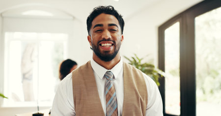 Hospitality, portrait and man at hotel reception for customer service, welcome or luxury accommodation. Smile, friendly concierge and happy in lobby for check in assistance, help or travel bookingの写真素材