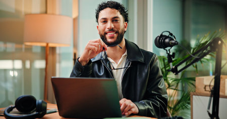 Happy, laptop and portrait of man with mic for broadcast, talk show and host interview. Night,...