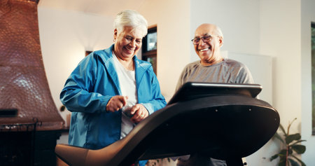 Elderly couple, treadmill and smile for fitness in home, walk and support with training in...