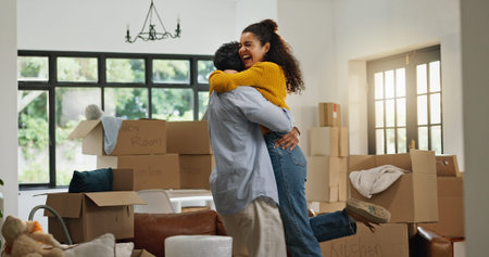 Hug, success and moving with couple in new home for property, support and mortgage approval. Real...