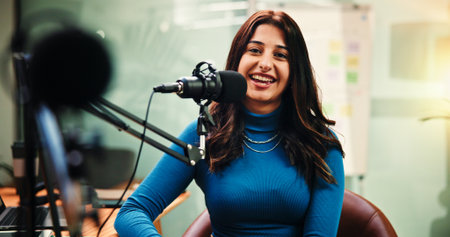 Mic, portrait and woman in studio for podcast, record broadcast and interview for radio show. Media agency, content creation and person with equipment for conversation, host and chat on live streamの写真素材