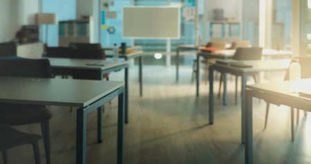 Empty room, education and furniture of classroom on campus for lecture, college and learning space. University Interior, architecture and back to school with desk and whiteboard for flare and academyの写真素材