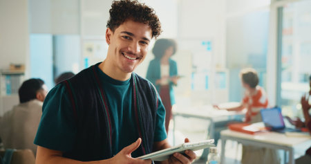 Tablet, learning and portrait of happy man in university classroom for study or development. Tech,...