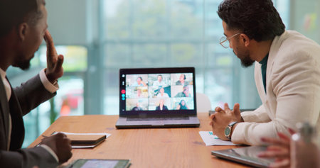 Laptop screen, video call and wave with business people in boardroom for online planning. Computer, conversation and virtual meeting with employee team in corporate office for development webinarの写真素材