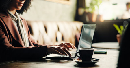 Creative, employee and hands with laptop, cafe and digital marketing on web, remote work and online. Freelance, social media specialist or person with tech for brand identity, research or coffee shopの写真素材