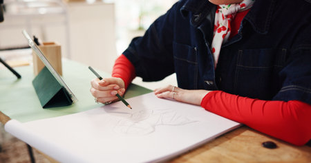 Woman, hands and sketching with pencil for fashion design, art or drawing in home. Female person, artist and tablet for reference with visual draft, artistic skill or talent for designer illustrationの写真素材