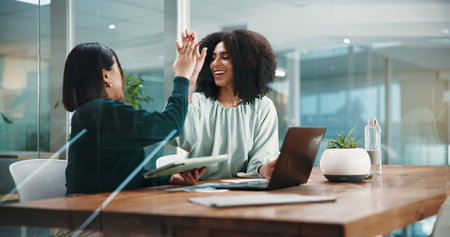 Business women, success and high five in office for motivation, excellence and teamwork. Workers,...