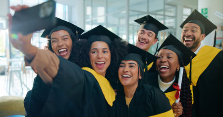 Selfie, university and students with smile, graduation and memory with college goals, app and degree. People, men and women with achievement, success and excited with profile picture or educationの写真素材