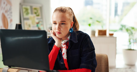Thinking, woman and reading with laptop at house for planning, research and feedback on article. Thoughts, female journalist and pc with story ideas, proofreading blog and solution for publicationの写真素材