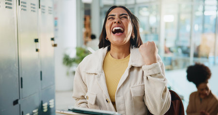 Woman, student and fist pump with tablet at college for results of assignment, exam and assessment. Excited, female person and digital for online mark, pass test and scholarship funding at universityの写真素材