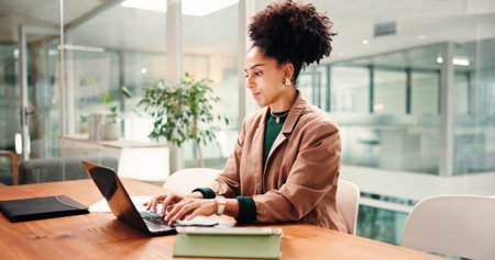Typing, business woman and laptop for social media, message or online communication in office. Idea...