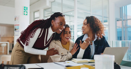 Women, university and students with laptop, excited and achievement with email for test results. People, group and friends with computer, education goals and scholarship with feedback for bursaryの写真素材