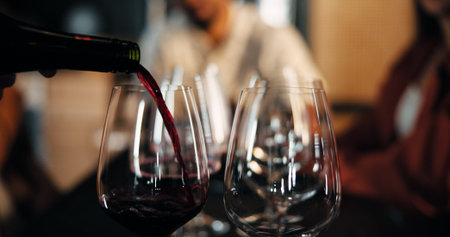 Bartender, glasses and wine with bottle for fine dining, alcohol or hospitality in restaurant....