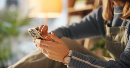 Home, relax and hands of woman with phone for social media, online networking and typing message....