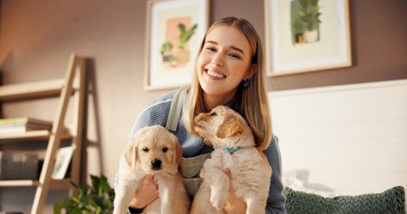 Woman, portrait and relax with puppies in home for pet adoption, bonding together and connection. Dog mom, girl and happy with Labrador animals in apartment for companion, furry best friends and loveの写真素材