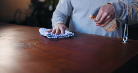 Cleaning, waiter and hands with chemical, bar and spray for hygiene, routine and sanitary for germs. Small business, disinfection and person with liquid for shine, cloth and maintenance of pubの写真素材