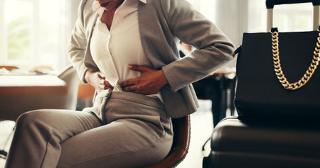Hands, business and woman with stomach pain in lobby for period ache, ibs and travel medical...