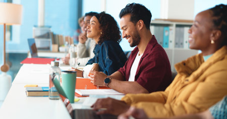 University, man and students in classroom, smile and learning with project. Happy people, men and women with education, college and academy with development, scholarship and assignment with jokeの写真素材