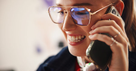 Phone call, glasses and smile with business woman in office for graphic designer, client briefing and contact. Project progress, communication and reflection with person in creative agency for spaceの写真素材