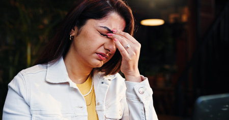 Headache, stress and woman in coffee shop with fatigue, burnout or exhaustion with freelance career....