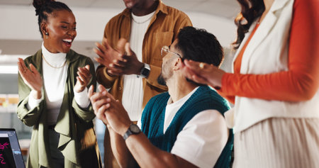 Excited business people, clapping hands and smile in promotion, announcement or success in office. Group of employees, applause and celebration for partnership, prize or workplace funding approvalの写真素材