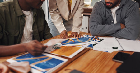 Creative, documents and hands of business people in meeting for planning, teamwork and project ideas. Startup agency, collaboration and workers brainstorming for design process, feedback and strategyの写真素材
