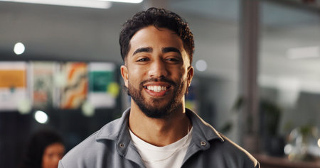 Portrait, creative and happy business man in office as graphic designer at internship. Smile, startup and professional employee with confidence, about us or career development for visual artistの写真素材